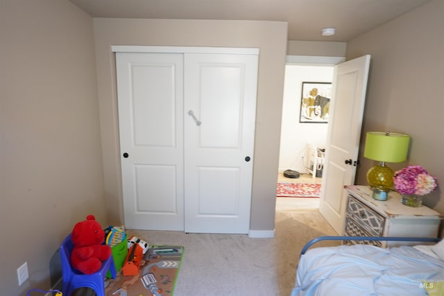 2431 Legacy Ct, Clarkston, WA 99403 - bedroom featuring light carpet, a closet, and baseboards