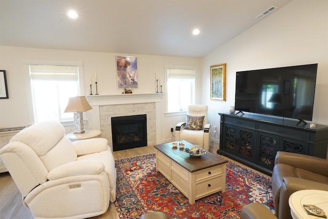 2431 Legacy Ct, Clarkston, WA 99403 - living room featuring vaulted ceiling, wood finished floors, a fireplace, and recessed lighting