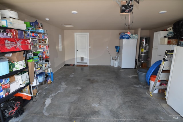 2431 Legacy Ct, Clarkston, WA 99403 - garage with a garage door opener and hybrid water heater