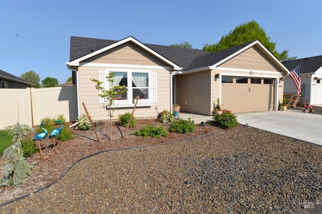 2431 Legacy Ct, Clarkston, WA 99403 - ranch-style home featuring a garage, fence, concrete driveway, and a shingled roof