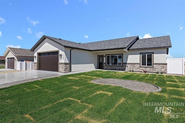 view of front facade with a garage and a front lawn