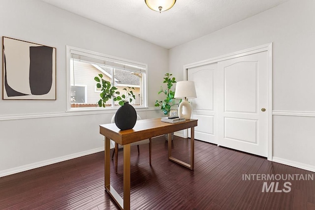 home office with dark wood finished floors and baseboards