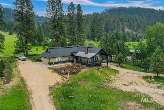 drone / aerial view featuring a view of trees