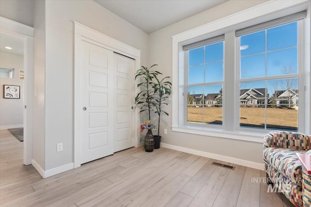 living area featuring light hardwood / wood-style floors