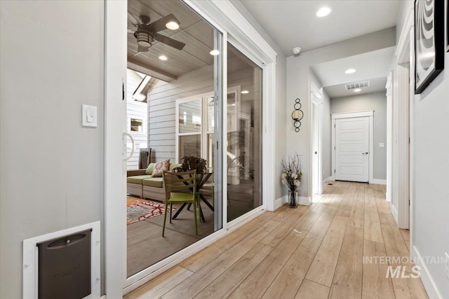 hall with light hardwood / wood-style flooring