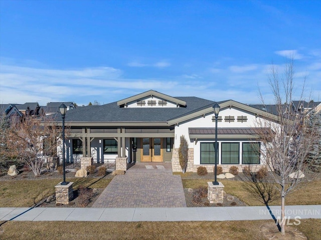 view of front of property with french doors and a front yard