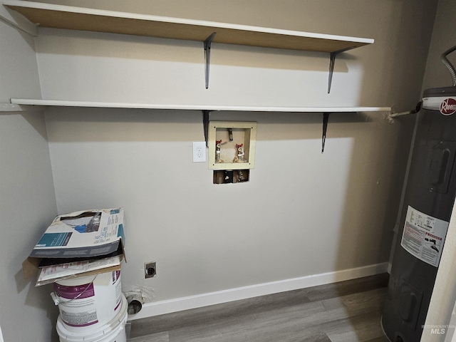 laundry area featuring electric water heater, hookup for an electric dryer, dark wood-type flooring, and hookup for a washing machine