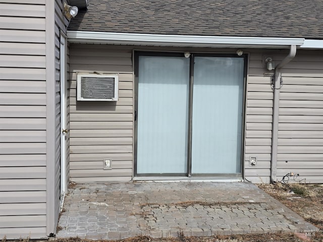 property entrance featuring a patio area