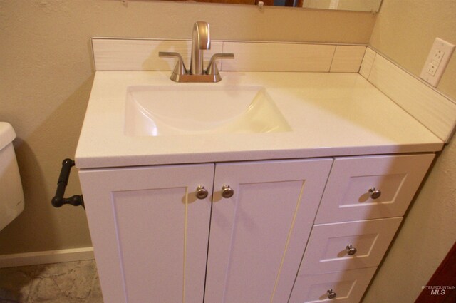 bathroom with vanity and toilet