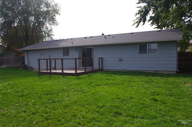 rear view of house featuring a patio area and a lawn