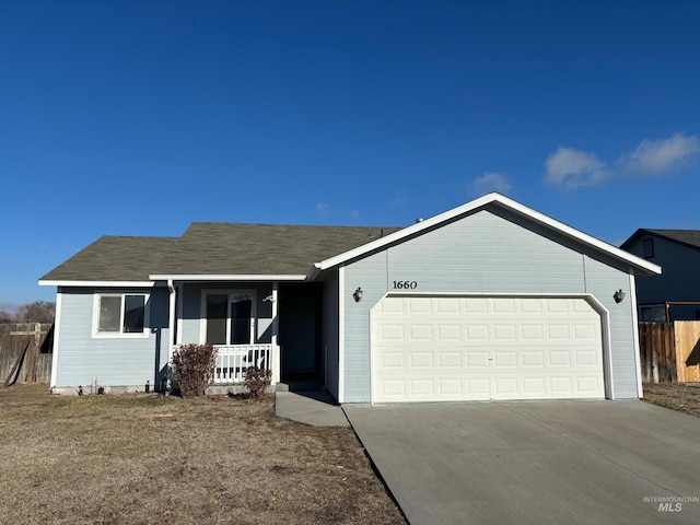 ranch-style house with a garage and a porch