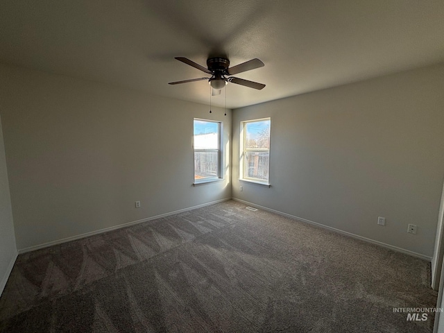 carpeted empty room with ceiling fan