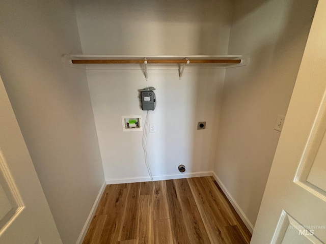 laundry room with wood-type flooring, hookup for a washing machine, and electric dryer hookup