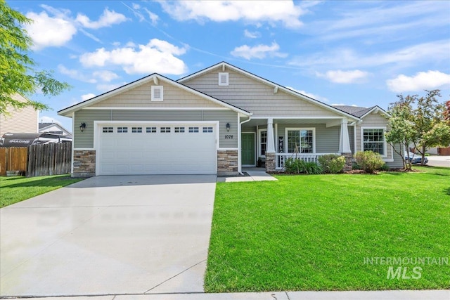 craftsman inspired home with stone siding, a porch, concrete driveway, and an attached garage