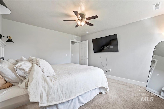 bedroom featuring arched walkways, carpet, ceiling fan, and baseboards