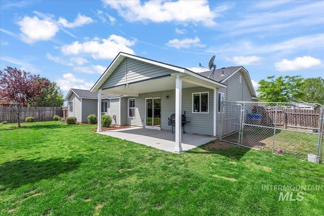 back of property featuring a patio area and a shingled roof