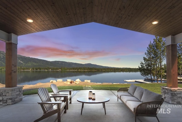 12975 Sandy Dr, Donnelly, ID 83615 - view of patio featuring outdoor lounge area and a water and mountain view