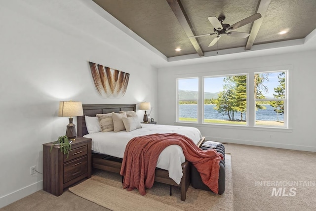 12975 Sandy Dr, Donnelly, ID 83615 - bedroom with light carpet, multiple windows, baseboards, beam ceiling, and recessed lighting