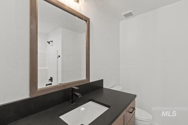 12975 Sandy Dr, Donnelly, ID 83615 - full bathroom featuring toilet and vanity