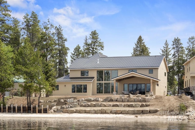 12975 Sandy Dr, Donnelly, ID 83615 - rear view of property with metal roof and a patio area