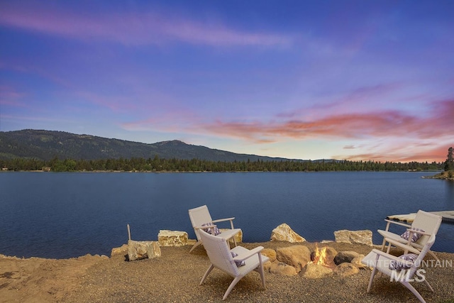 12975 Sandy Dr, Donnelly, ID 83615 - water view with an outdoor fire pit and a mountain backdrop