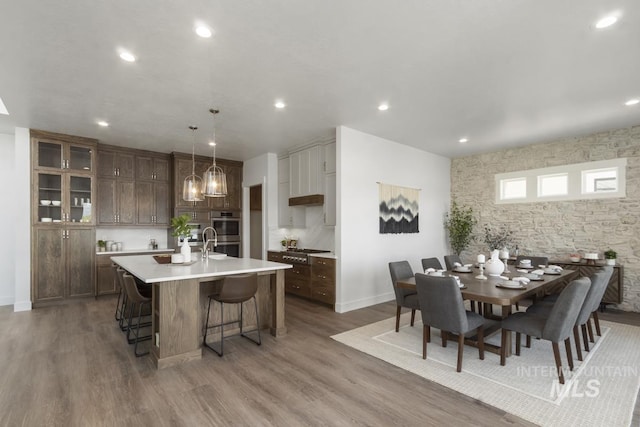 12975 Sandy Dr, Donnelly, ID 83615 - dining room with wood finished floors, recessed lighting, baseboards, and a chandelier