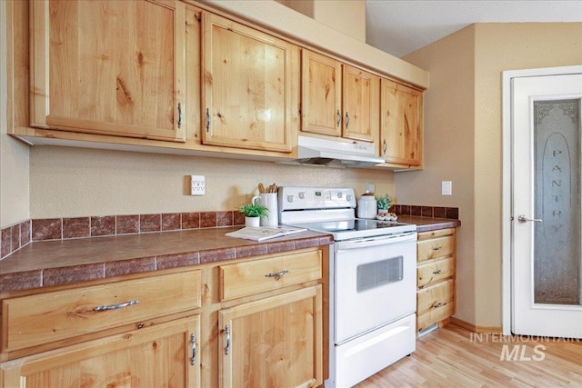 4240 N 1400 E, Buhl, ID 83316 - kitchen featuring white range with electric cooktop, under cabinet range hood, light brown cabinets, and light wood-style floors