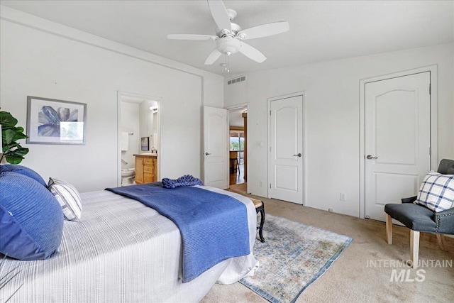 4240 N 1400 E, Buhl, ID 83316 - bedroom featuring light carpet, connected bathroom, and ceiling fan