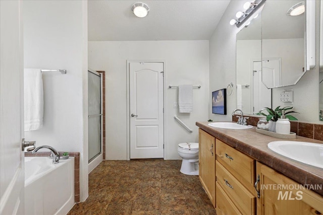 4240 N 1400 E, Buhl, ID 83316 - full bathroom featuring a garden tub, double vanity, a stall shower, and toilet