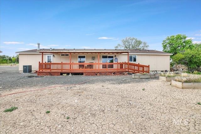 4240 N 1400 E, Buhl, ID 83316 - rear view of property with a wooden deck, central AC unit, and crawl space