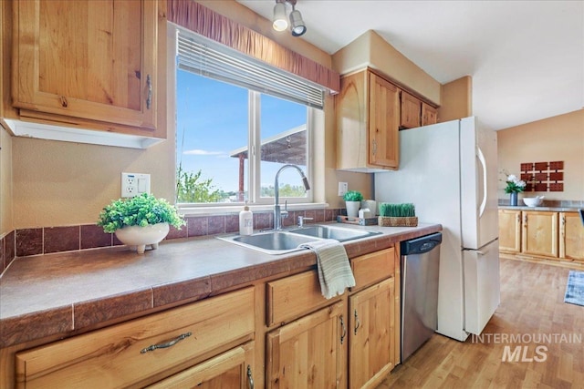 4240 N 1400 E, Buhl, ID 83316 - kitchen with stainless steel dishwasher, a sink, and light wood-style flooring