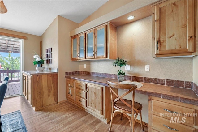 4240 N 1400 E, Buhl, ID 83316 - kitchen featuring light wood-type flooring, glass insert cabinets, and dark countertops