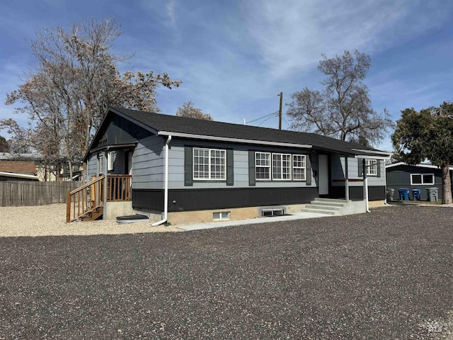 view of front of house featuring fence