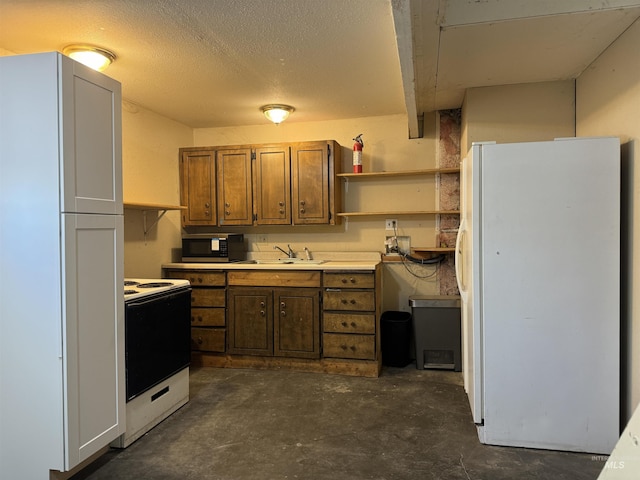 kitchen featuring open shelves, a sink, unfinished concrete flooring, white appliances, and light countertops