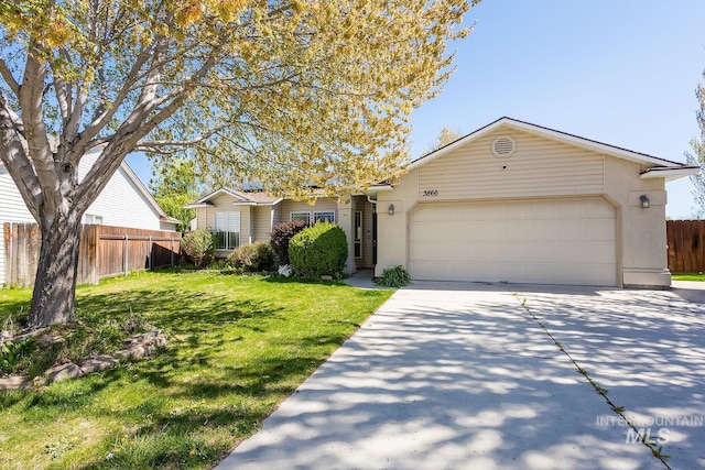 ranch-style house with concrete driveway, fence, a garage, a front yard, and stucco siding