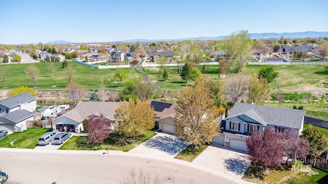birds eye view of property with a mountain view and a residential view