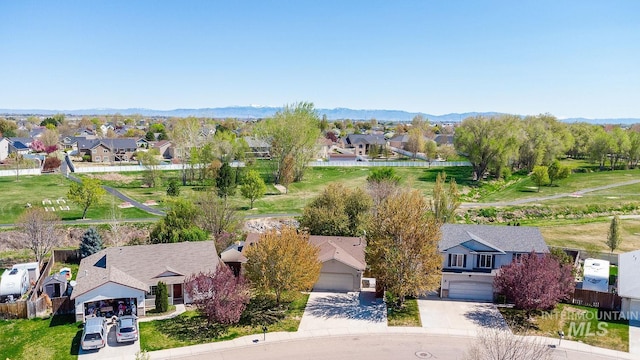 birds eye view of property featuring a mountain view and a residential view