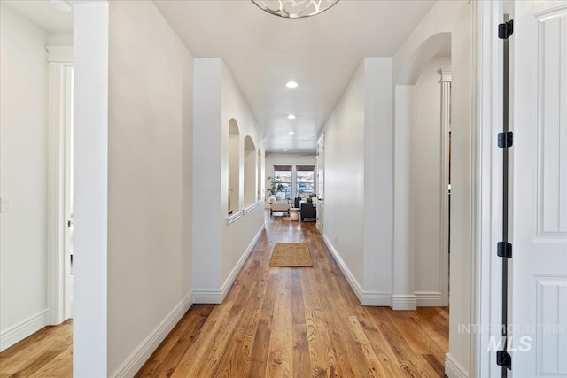 hall with light hardwood / wood-style floors