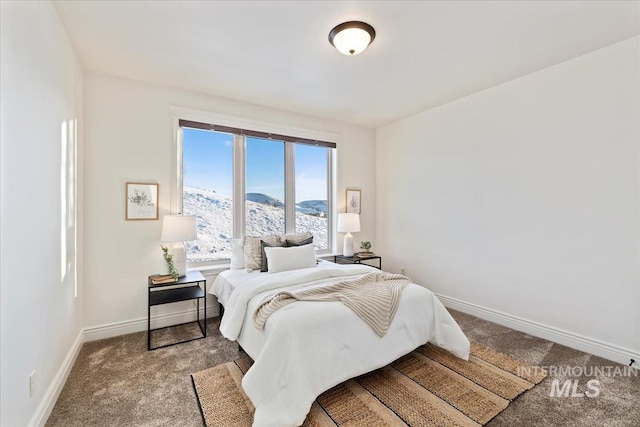 carpeted bedroom with a mountain view