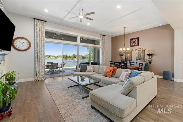547 S Rivermist Ave, Star, ID 83669 - living area with a ceiling fan, a chandelier, wood finished floors, recessed lighting, and a water view