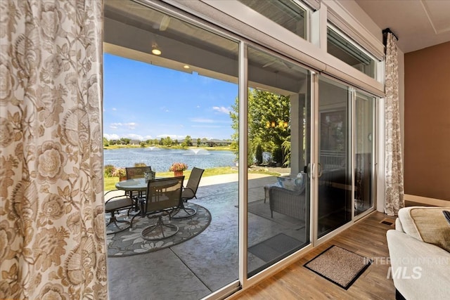547 S Rivermist Ave, Star, ID 83669 - doorway featuring a water view and wood finished floors