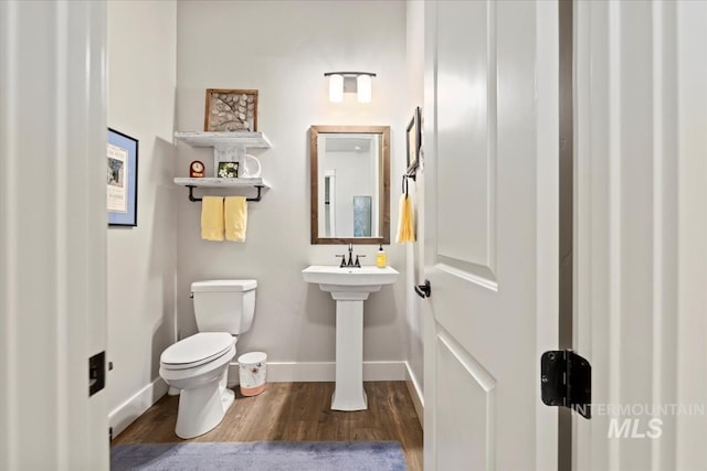 547 S Rivermist Ave, Star, ID 83669 - half bathroom featuring wood finished floors and toilet