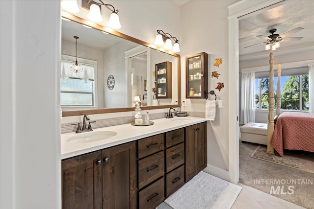 547 S Rivermist Ave, Star, ID 83669 - ensuite bathroom with double vanity, a ceiling fan, and tile patterned floors