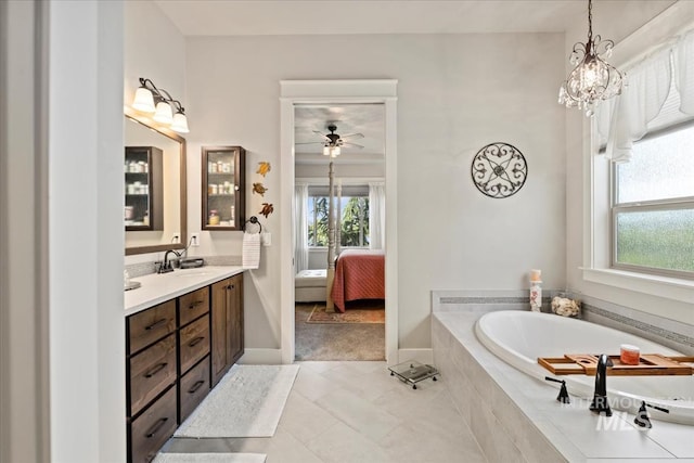 547 S Rivermist Ave, Star, ID 83669 - bathroom with vanity, a garden tub, ensuite bathroom, tile patterned floors, and a ceiling fan