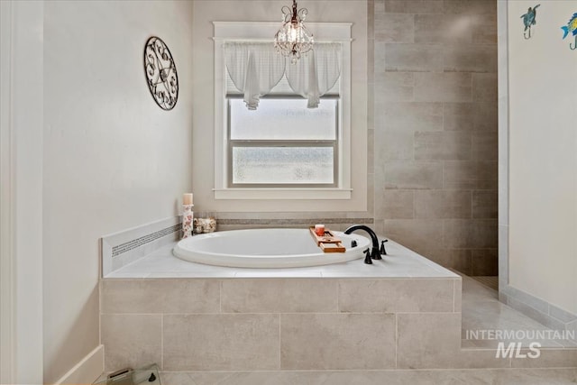 547 S Rivermist Ave, Star, ID 83669 - full bathroom with a bath and a chandelier