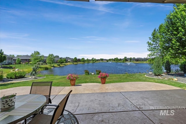 547 S Rivermist Ave, Star, ID 83669 - view of patio / terrace featuring a water view, outdoor dining space, and a residential view