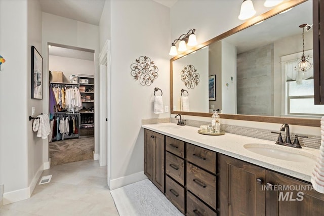 547 S Rivermist Ave, Star, ID 83669 - bathroom featuring double vanity and a walk in closet