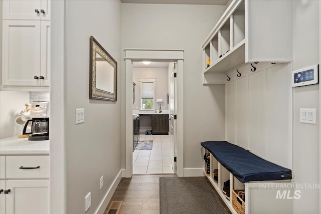547 S Rivermist Ave, Star, ID 83669 - mudroom featuring baseboards and wood finished floors