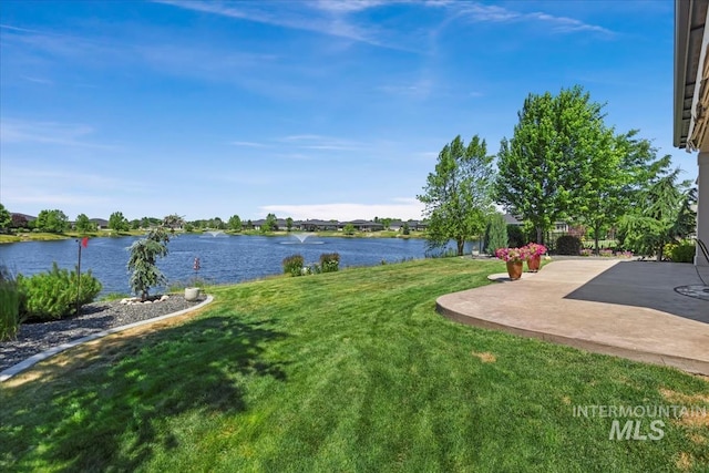547 S Rivermist Ave, Star, ID 83669 - view of green lawn featuring a water view and a patio area