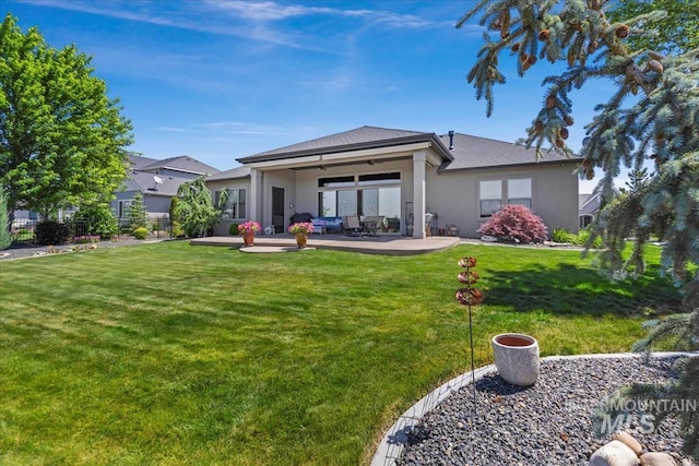 547 S Rivermist Ave, Star, ID 83669 - rear view of property with a ceiling fan, stucco siding, a patio area, and an outdoor living space